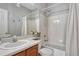 Bright bathroom featuring a shower-tub combination and a light wood vanity at 17050 Park Trail Dr, Monument, CO 80132