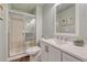 Bathroom with a glass shower, a white vanity, and light green paint at 17050 Park Trail Dr, Monument, CO 80132