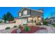Beautiful two-story home with a well-manicured lawn and mature trees at 17050 Park Trail Dr, Monument, CO 80132