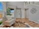 Elegant foyer with a staircase and a decorative medallion, hardwood floors at 17050 Park Trail Dr, Monument, CO 80132