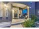 Inviting front porch with seating, a decorative wreath, and elegant number display at 17050 Park Trail Dr, Monument, CO 80132