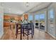 Eat-in kitchen with stainless appliances, wood cabinets, and sliding door access to patio at 17050 Park Trail Dr, Monument, CO 80132