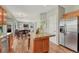 Spacious kitchen with stainless steel appliances and granite countertops open to the dining area at 17050 Park Trail Dr, Monument, CO 80132