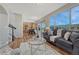 Bright living room features large windows, modern furnishings, and scenic views at 17050 Park Trail Dr, Monument, CO 80132
