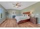 Lovely primary bedroom with hardwood floors, fireplace, and ensuite bathroom at 17050 Park Trail Dr, Monument, CO 80132