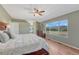 Large main bedroom with hardwood floors, bed, large window, and mountain views at 17050 Park Trail Dr, Monument, CO 80132