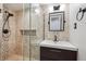 Tiled bathroom with glass-enclosed shower, modern vanity, and updated fixtures offering a spa-like experience at 2777 S Adams St, Denver, CO 80210