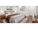 A modern bedroom with neutral tones, stylish decor, and comfortable furnishings at 2777 S Adams St, Denver, CO 80210