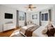 Serene bedroom with hardwood floors, natural light, and neutral decor, creating a peaceful and relaxing retreat at 2777 S Adams St, Denver, CO 80210
