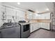 A functional laundry room with modern washer, dryer, ample storage, and countertop space at 2777 S Adams St, Denver, CO 80210
