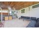 Covered patio with built-in grill area and comfortable seating at 2777 S Adams St, Denver, CO 80210