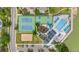 Aerial view of community amenities, including a pool, tennis courts, volleyball court, playground and parking at 1181 E 130Th Pl, Thornton, CO 80241