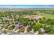 Aerial shot of the neighborhood showcasing a golf course, homes, and greenery at 1181 E 130Th Pl, Thornton, CO 80241
