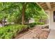 Landscaped backyard with stone pathways, mature trees and a storage shed at 1181 E 130Th Pl, Thornton, CO 80241