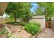 Beautiful landscaped backyard with stone patio and a charming storage shed at 1181 E 130Th Pl, Thornton, CO 80241