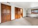 Finished basement featuring neutral carpet, ample closet space, and staircase access at 1181 E 130Th Pl, Thornton, CO 80241