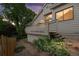 Back exterior featuring garden and walkway leading to an upper deck area at 1181 E 130Th Pl, Thornton, CO 80241