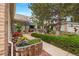 Well maintained yard with an inviting walkway, colorful flowers, and charming front porch sitting area at 1181 E 130Th Pl, Thornton, CO 80241