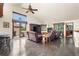 Bright living room featuring hardwood floors, a large window, cozy seating, and a fireplace at 1181 E 130Th Pl, Thornton, CO 80241