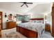 Spacious bedroom with large windows, vaulted ceiling, wooden furniture and a ceiling fan at 1181 E 130Th Pl, Thornton, CO 80241
