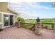 Relaxing back deck boasting stone pillars and serene golf course views, great for outdoor enjoyment at 2349 Hickory Pl, Erie, CO 80516