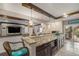 Luxurious bar area with granite countertop, wood accents, and counter seating at 2349 Hickory Pl, Erie, CO 80516