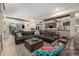 Open basement featuring a stone wall, fireplace, kitchenette and large comfortable leather couches at 2349 Hickory Pl, Erie, CO 80516
