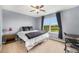 Comfortable bedroom with a window overlooking an expansive golf course at 2349 Hickory Pl, Erie, CO 80516