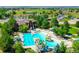 Aerial view of the community pool area, featuring multiple pools, a splash park, and ample seating for residents at 2349 Hickory Pl, Erie, CO 80516