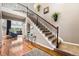 Elegant foyer with hardwood floors, a grand staircase, and views into the inviting living room at 2349 Hickory Pl, Erie, CO 80516