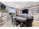 Game room with a poker table, wall-mounted TVs, and memorabilia at 2349 Hickory Pl, Erie, CO 80516