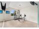 Bright home gym featuring fitness equipment and a large window at 2349 Hickory Pl, Erie, CO 80516