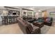 Comfortable living room with a dark brown leather sofa set and a built in bar, perfect for entertaining at 2349 Hickory Pl, Erie, CO 80516