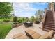 Inviting outdoor patio featuring comfortable seating, a fire pit, and scenic golf course views for ultimate relaxation at 2349 Hickory Pl, Erie, CO 80516