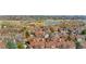 Lovely aerial view of townhomes near a pond and green space, creating a serene community setting at 8773 W Cornell Ave # 10, Lakewood, CO 80227