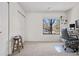 Bright bedroom features neutral carpet, white walls, closet, and large window offering ample natural light at 8773 W Cornell Ave # 10, Lakewood, CO 80227