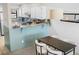Cozy dining area adjacent to the kitchen, featuring a modern table and chairs at 8773 W Cornell Ave # 10, Lakewood, CO 80227
