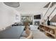 Comfortable living room with fireplace, mounted TV and a dining table nearby at 8773 W Cornell Ave # 10, Lakewood, CO 80227