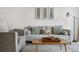 Comfortable living room with a sofa and chair, decorated with natural prints and stylish accents at 8773 W Cornell Ave # 10, Lakewood, CO 80227