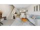 Bright living room with staircase and view of the kitchen at 8773 W Cornell Ave # 10, Lakewood, CO 80227