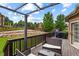 Back deck with outdoor seating with privacy fencing and a view of the beautiful backyard at 334 Green Rock Pl, Monument, CO 80132