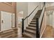 Elegant foyer with a staircase, hardwood floors, and natural light, creating a welcoming atmosphere at 334 Green Rock Pl, Monument, CO 80132