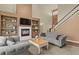 Cozy living room with fireplace, built-in shelving, and comfortable seating arrangement at 334 Green Rock Pl, Monument, CO 80132