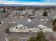 An aerial view of townhomes with attached garages, multiple windows, and private patios at 8621 E Dry Creek Rd # 325, Englewood, CO 80112