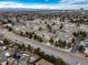 An aerial view of a residential community with mature trees near a major thoroughfare at 8621 E Dry Creek Rd # 325, Englewood, CO 80112