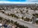 Sprawling community aerial view showcasing well-maintained townhomes and lush landscaping with mountain views in the background at 8621 E Dry Creek Rd # 325, Englewood, CO 80112