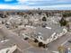Community aerial featuring well-kept properties, landscaped streets, and an urban backdrop with a variety of townhome styles at 8621 E Dry Creek Rd # 325, Englewood, CO 80112
