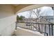 Cozy balcony with views of the common area and complex parking at 8621 E Dry Creek Rd # 325, Englewood, CO 80112