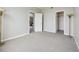 Bedroom with neutral walls, a closet, and a doorway to another room at 8621 E Dry Creek Rd # 325, Englewood, CO 80112