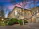 Charming townhome features a private balcony, attached garage, and lush landscaping at 8621 E Dry Creek Rd # 325, Englewood, CO 80112